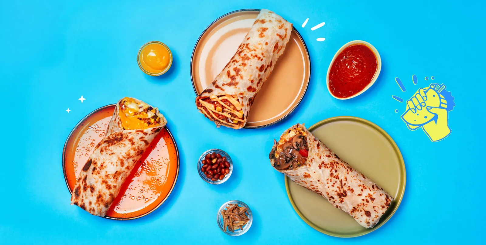 Rollti roti canai wraps with sauces on a blue table